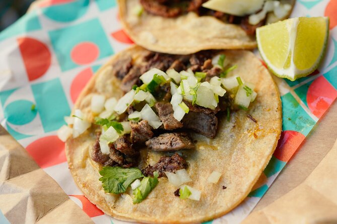 3-Hour Night Tacos and Mezcal Crawl in Mexico with Guide - Walking through Roma Norte between bites