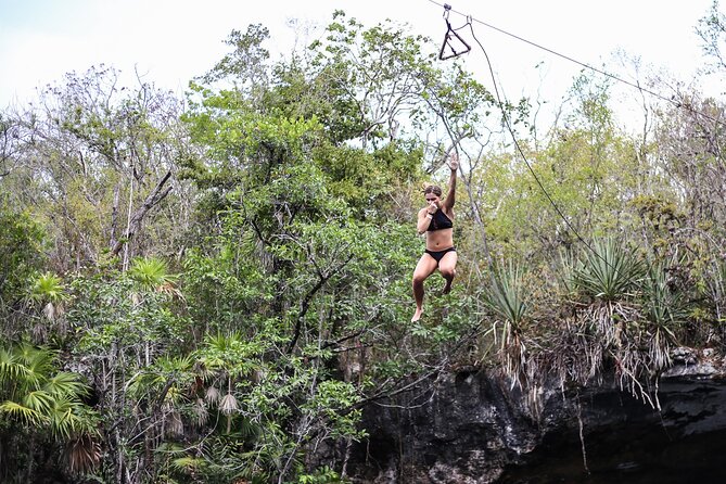 4 Private Cenotes, Zip-Lines, Canoes & Mayan Village with Delicious Lunch - Canoes, snorkeling, and a cliff jump