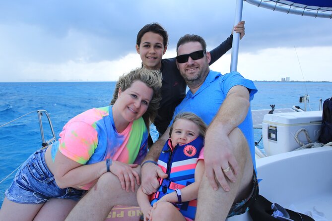 All Inclusive Isla Mujeres Catamaran - Arriving at Playa Tortugas and paying the dock fee