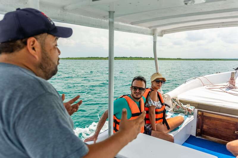 Bacalar: 3 Hour Boat Trip with Swimming & Drinks - Guide quality, music, and the shared-boat mood