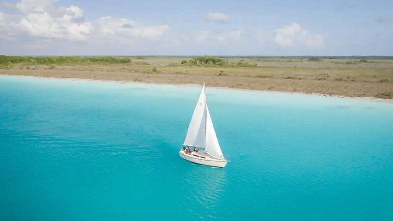 Bacalar: Group Sailing Trip with Swimming and Drinks - Cenote Esmeralda and the first stretch of water