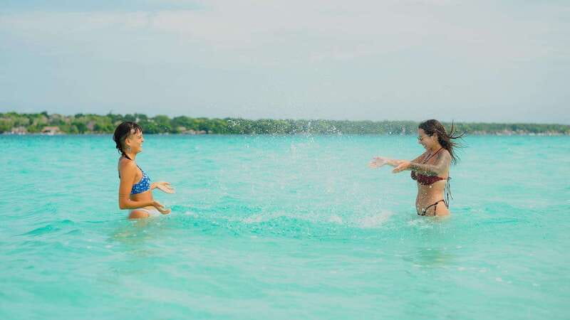 Bacalar Lagoon Sightseeing Boat Tour with Open Bar & Snack - Cenote Negro and the lagoon’s depth