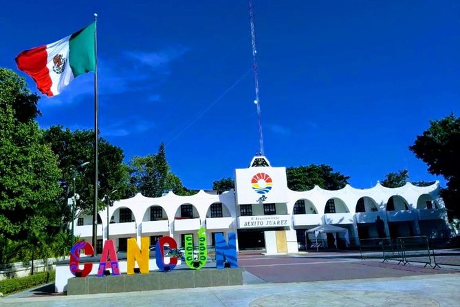 Cancun City Sightseeing and Shopping Tour on a Double Decker bus - Avenida Tulum and the city beyond the resorts
