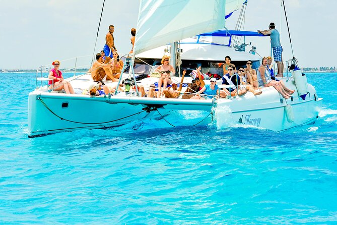 Catamaran to Isla Mujeres Snorkeling Tour with Open Bar and Lunch - Beach-club time and the late buffet