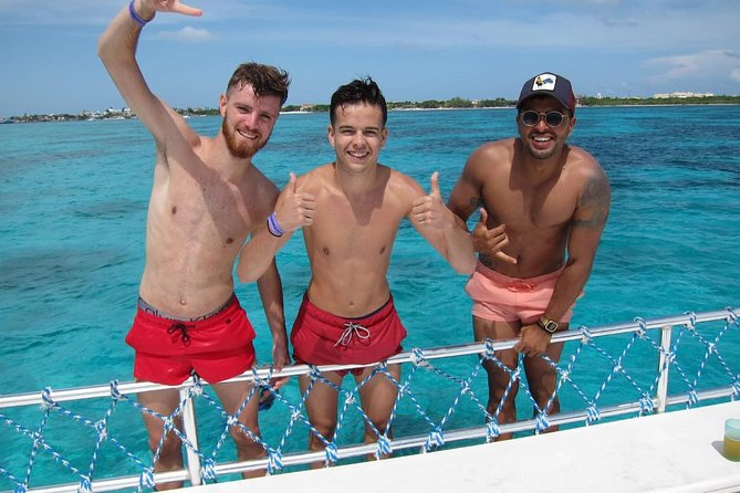 Catamaran Tour to Isla Mujeres all Included - Upper-deck jumps and the party atmosphere