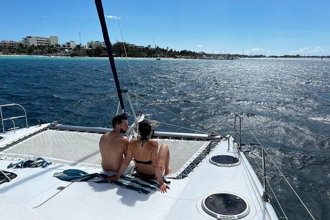 Isla Mujeres Day Tour with Catamaran, Snorkeling & Beach Club - Returning to Cancun with music and drinks