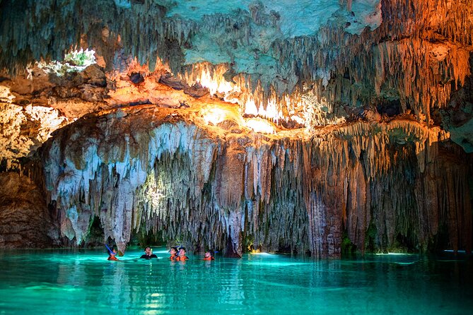 Magical Cenote and Paradise Lagoon Snorkeling Adventure - Entering the cenote: cool water and total darkness