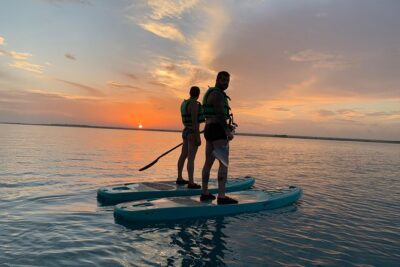 Paddleboarding and/or kayaking tour at sunrise in the lagoon of Bacalar