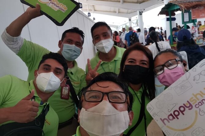 Private Roundtrip Transportation from Cancun Airport to Ferry Isla Mujeres - Finding the green shirts at Cancun Airport
