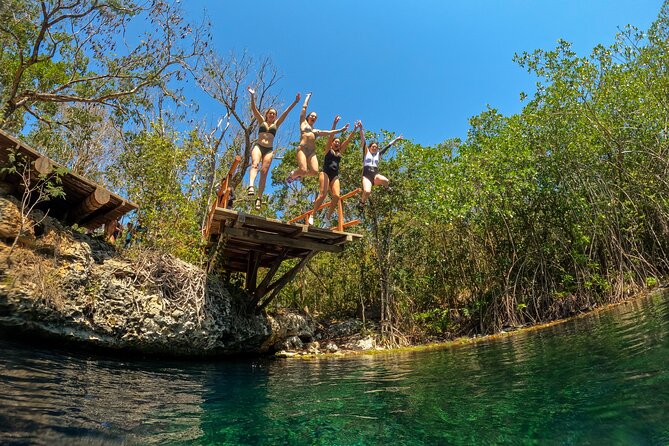 Ride to a life changing cenotes tour - Second cenote, sunlight over a semi-open pool