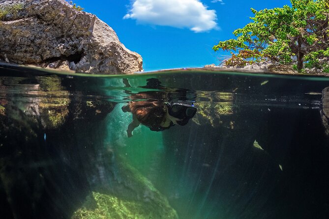 Tulum Guided Tour, Magical Cenote, Lagoon Snorkeling and Beachside Lunch - Swimming through Cenote El Sueño